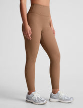 brown midi length leggings with a 4" waistband and no front rise seam.